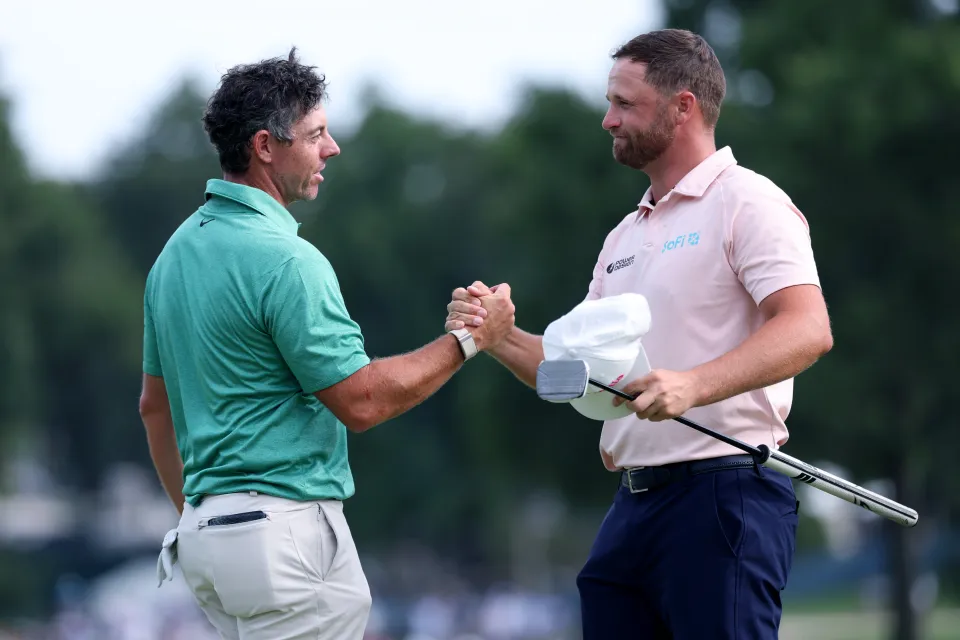 Rory McIlroy and Wyndham Clark embrace at the BMW Championship