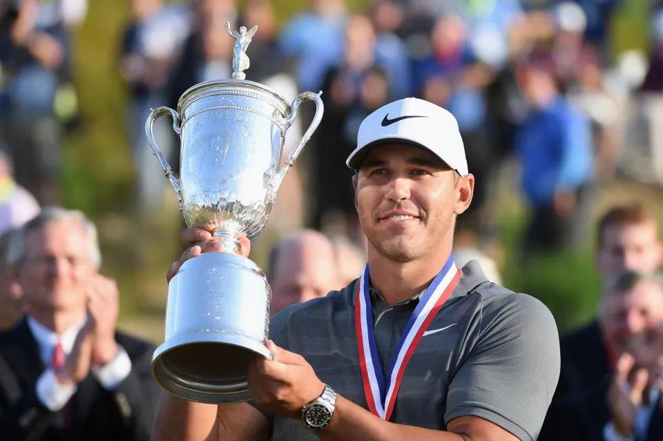Brooks Koepka with the 2018 US Open trophy