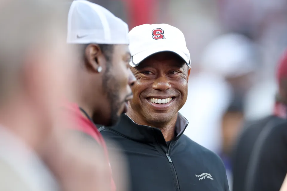 Professional golfer and Stanford Cardinal alumni Tiger Woods stands on the sidelines during the first half of the Stanford Cardinal game against the Miami (FL) Hurricanes at Stanford Stadium on September 04, 2026