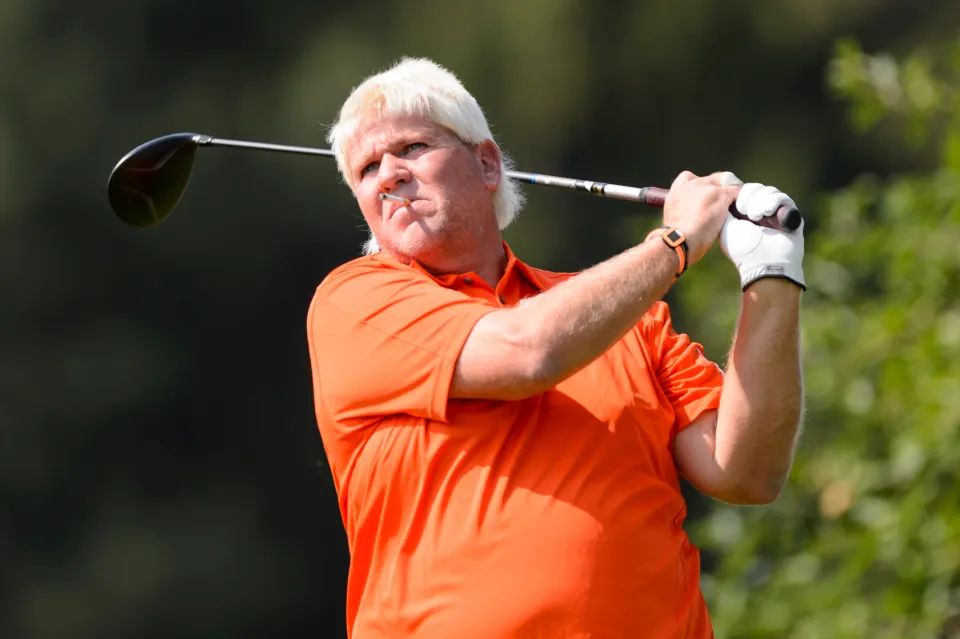 ohn Daly smokes a cigarette during the practice round of the 2014 RBC Canadian Open at the Royal Montreal Golf Club in ??le Bizard Quebec, Canada.