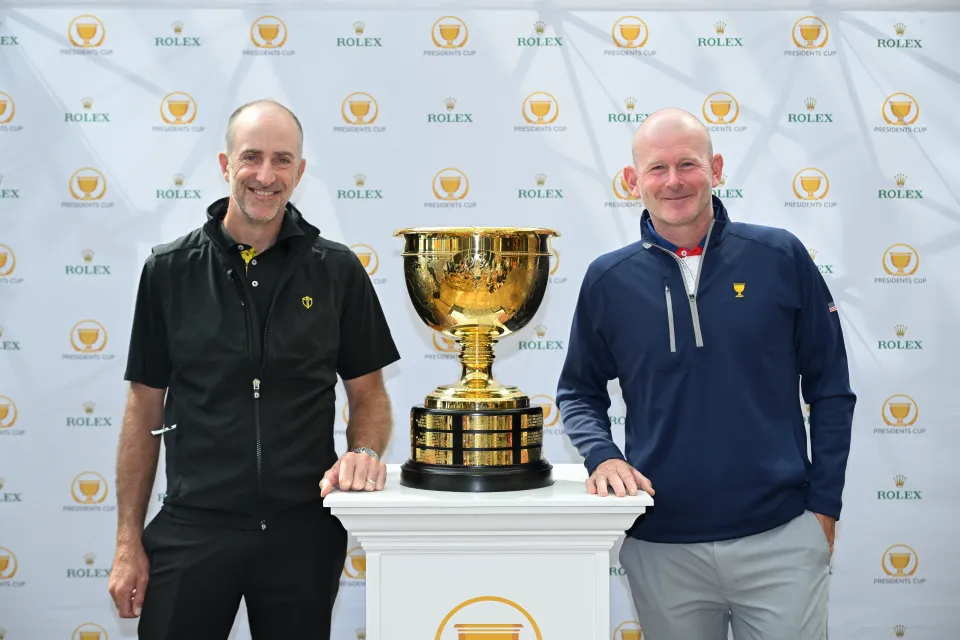 Team International Captain, Geoff Ogilvy, and U.S. Team Captain, Brandt Snedeker, stand with the Presidents Cup, at Cindy's Rooftop restaurant, on April 28, 2025, in Chicago, Illinois.