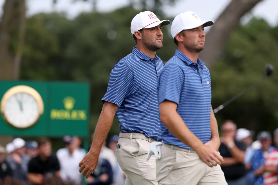 Scottie Scheffler of the U.S. Team and Sam Burns of the U.S. Team walk off the second tee during Thursday's Four-ball matches on day one of the Presidents Cup 2026 at Medinah Country Club on September 24, 2026 in Medinah, Illinois.